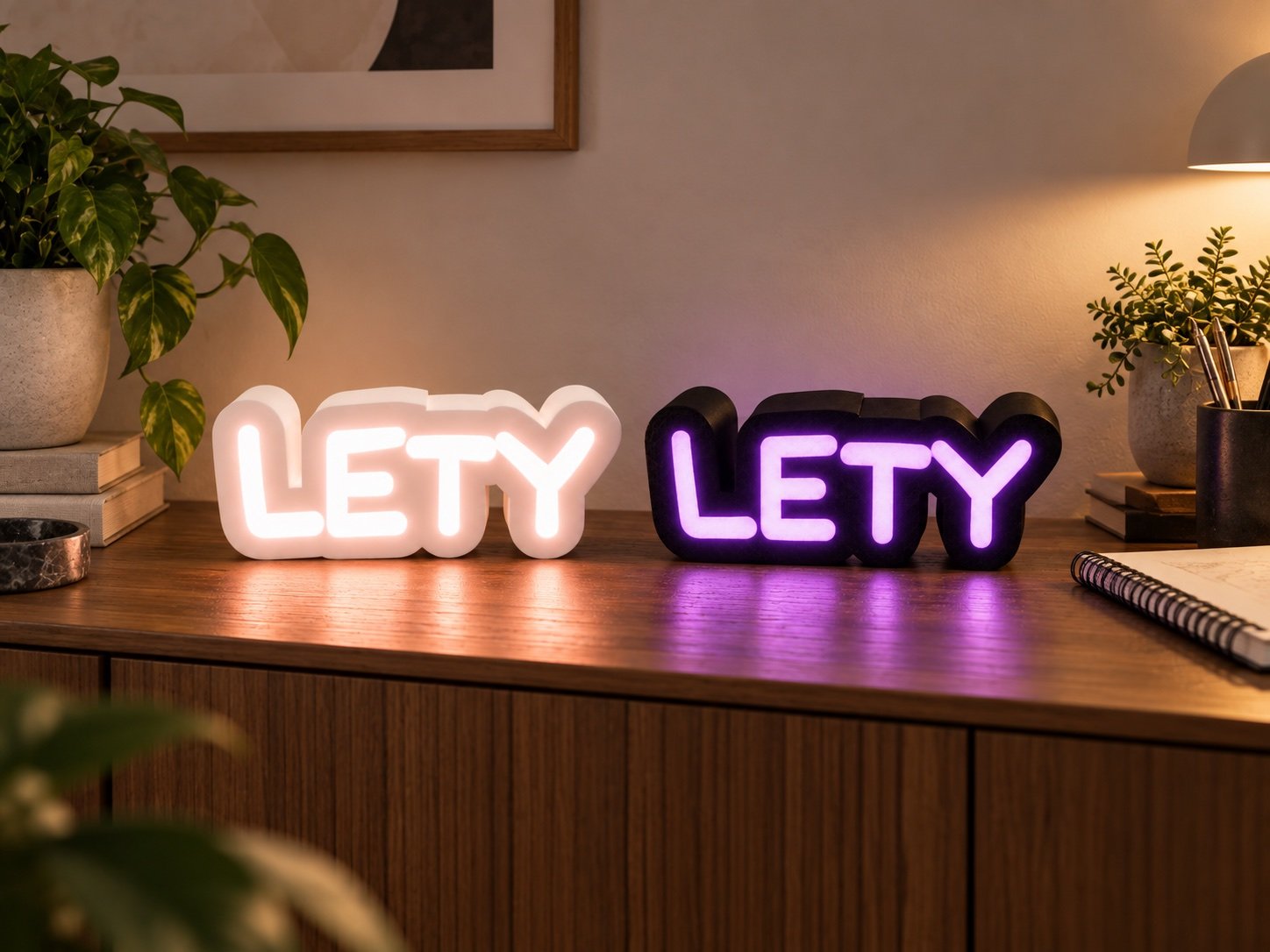 Two LETY name lamp concepts together, one warm white and one dark with purple light